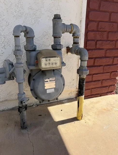 Gas meter assembly with steel piping and shut-off valves installed by Economy Plumbing SD in San Diego