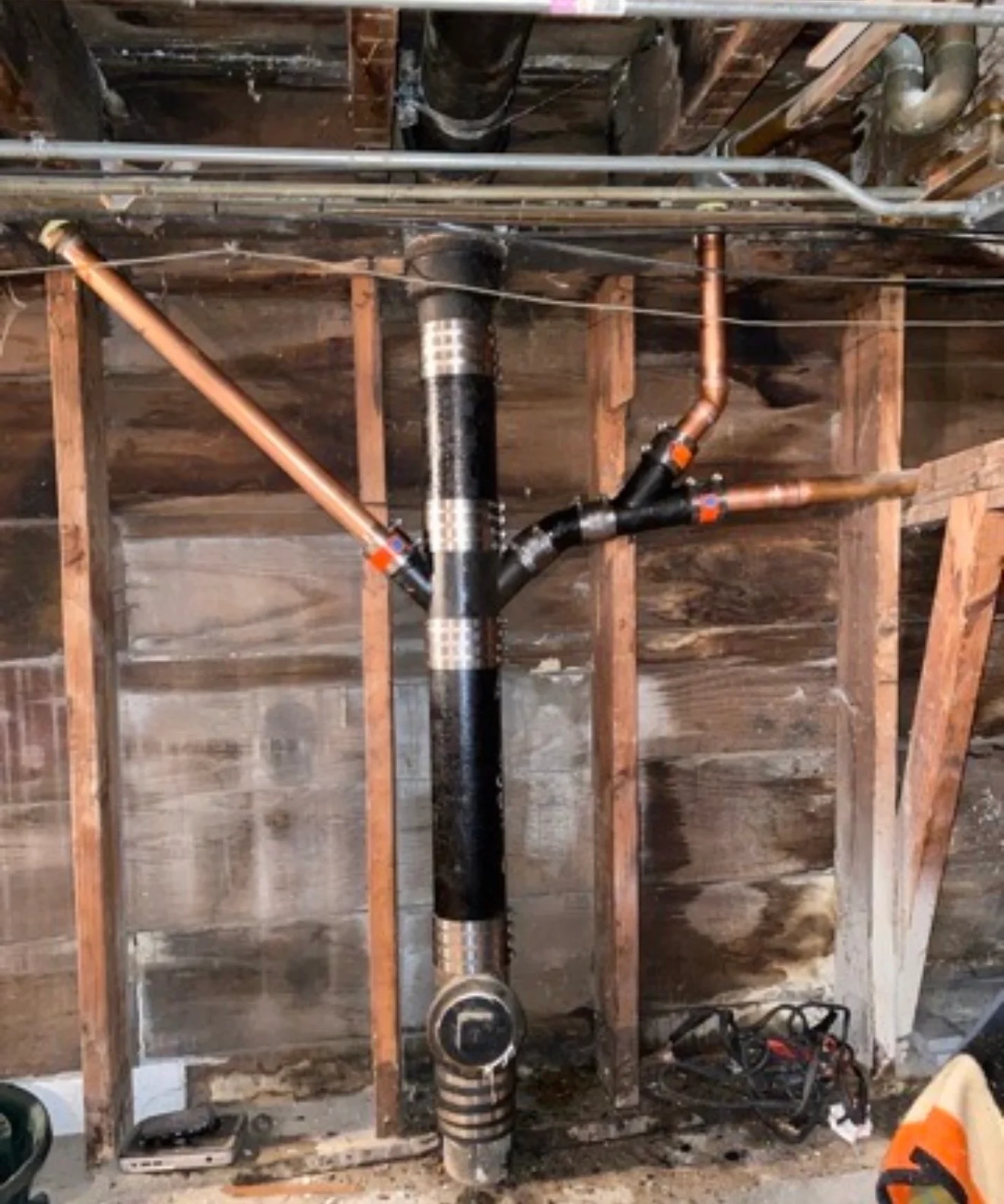 Copper repiping with new water heater, soldered joints, and isolation valves in basement framing