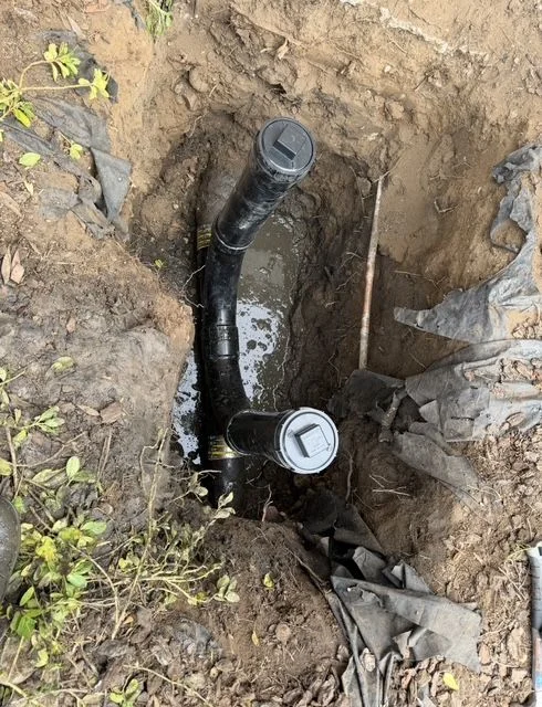 Exposed corroded cast iron sewer pipe during excavation and replacement by Economy Plumbing SD in San Diego